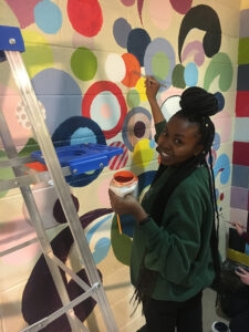 uplifting mural painted at homeless shelter