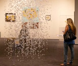 Museum visitor viewing the 5535-2017 memorial sculpture Museum visitor viewing the 5535-2017 memorial sculpture